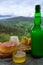 cider made fromÂ fermented apples and Asturian cow smoked cheese and view Picos de Europa mountains on background